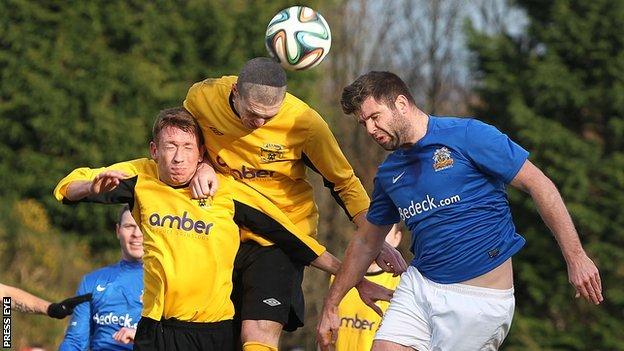 Dan McMurray and Ryan Deans in aerial action with Glenavon's Simon Kelly