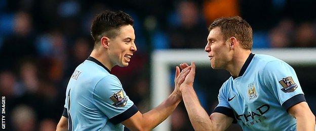 Manchester City's Samir Nasri (left) and James Milner celebrate their side's equaliser against Hull