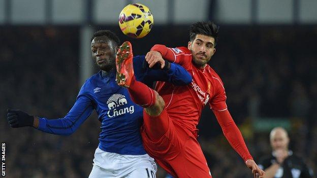 Everton forward Romelu Lukaku challenges with Liverpool's Emre Can