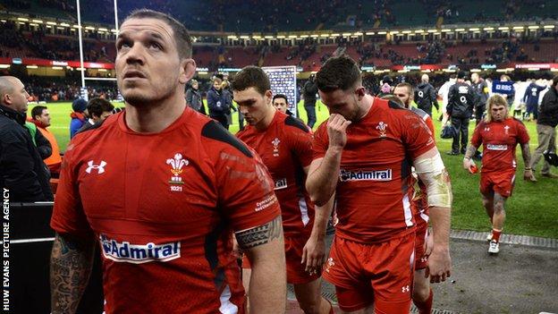 Paul James and team-mates leave the Millennium Stadium pitch after defeat to England
