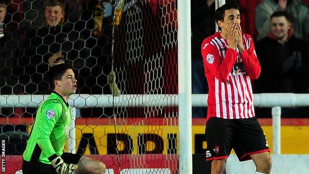 Craig Woodman reacts after scoring an own goal against Cambridge