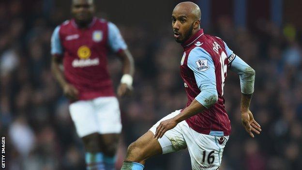 Aston Villa's Fabian Delph (right)