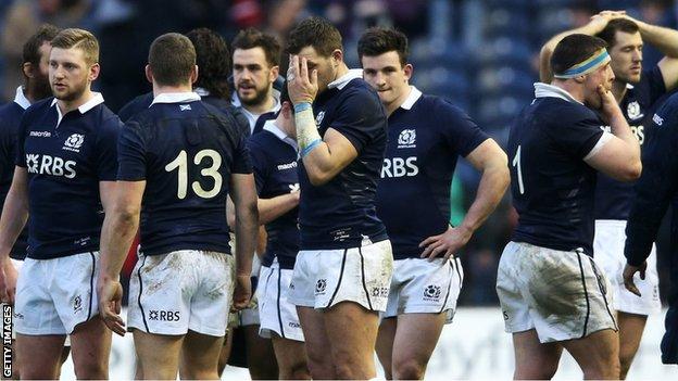 The Scotland players look dejected at full-time