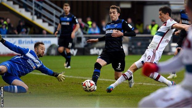 Bayern Munich striker Robert Lewandowski scores against SC Paderborn
