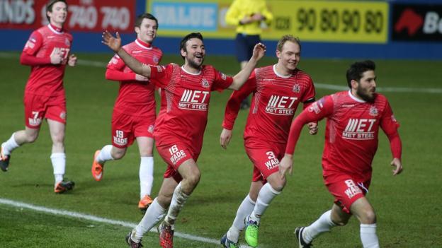 Portadown players chase Sean Mackle after his late winner in a 2-1 victory over the Blues