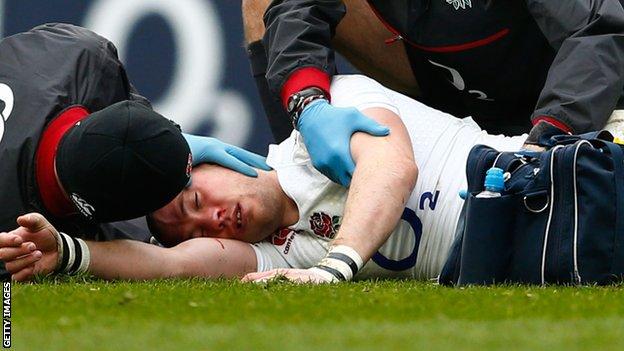 England full-back Mike Brown receives treatment for a head injury