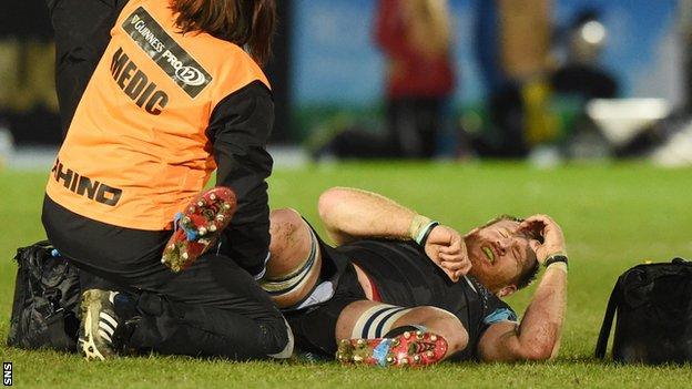 Tyrone Holmes is treated on the pitch during the win over Ospreys