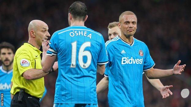 Sunderland defender Wes Brown (right) shows his dismay at being sent off by referee Roger East