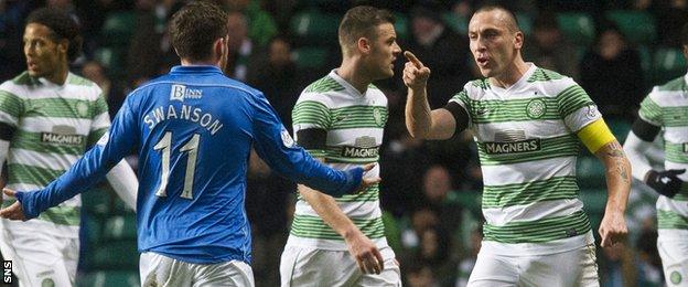 Goalscorer Danny Swanson (left) and Celtic captain Scott Brown clash.