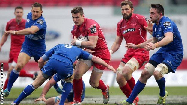 Scott Williams is tackled by Eoin Reddan and Jack Conan