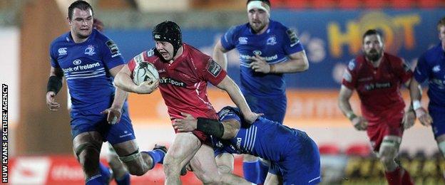 Scarlets Man of the Match James Davies is tackled by Ben Te'o