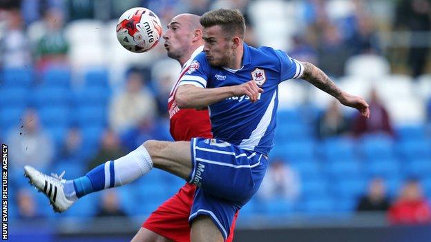 Cardiff City's Joe Ralls and Charlton's Christophe Lepoint compete for the ball