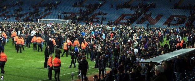 Fans on the Villa Park pitch after Aston Villa's FA Cup quarter-final win over West Brom