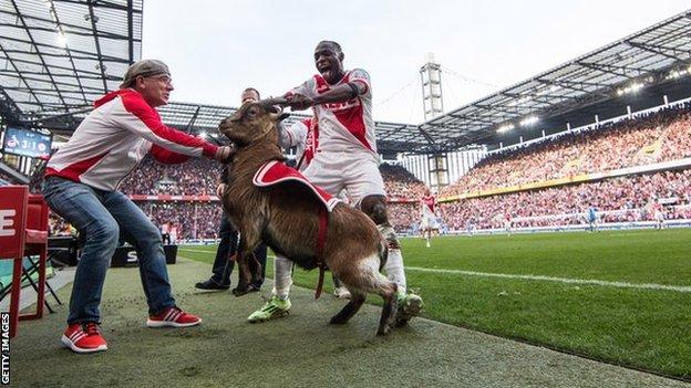 Anthony Ujah (right) and Hennes VIII the goat