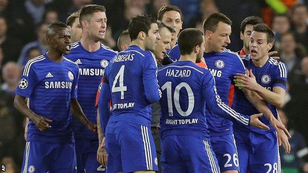 Chelsea players surrounded the referee