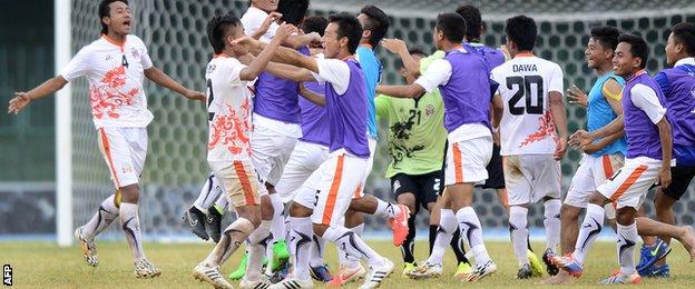 Bhutan players celebrate