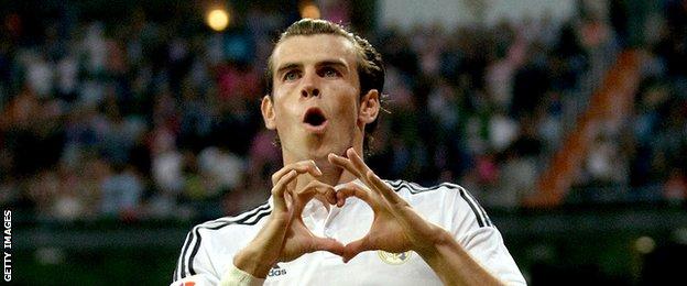 Gareth Bale celebrates with his trademark heart celebration