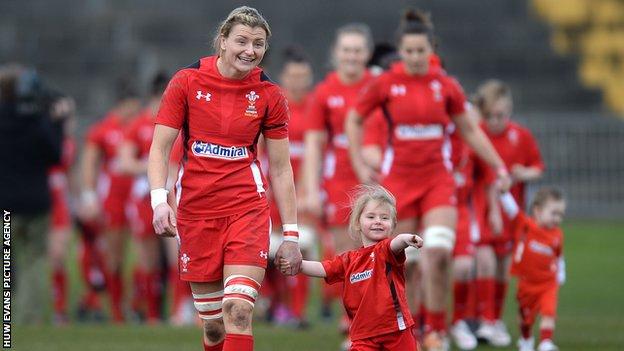 Rachel Taylor leads out the Wales side on the occasion of her 50th cap