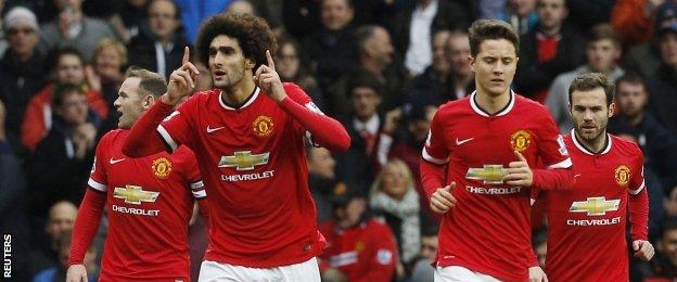 Marouane Fellaini celebrates after scoring United's first goal