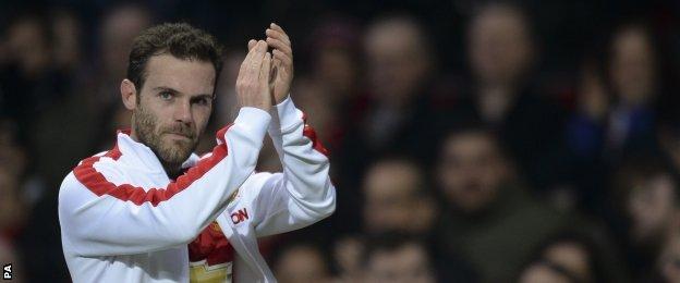 Juan Mata applauds the Old Trafford crowd after his substitution
