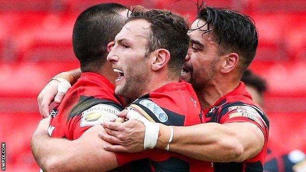 Salford's Weller Hauraki (left) is congratulated on his try by Tommy Lee and Rangi Chase (right)