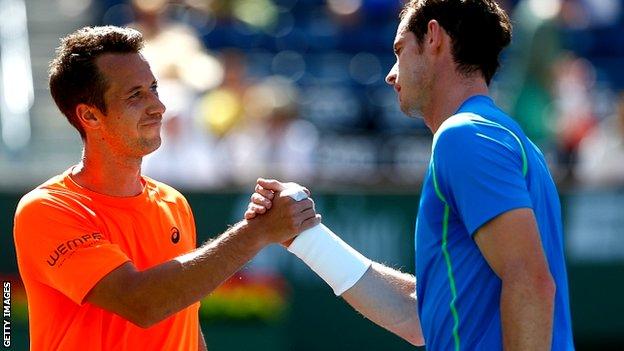 Andy Murray of Great Britain is congratulated by Philipp Kohlschreiber of Germany