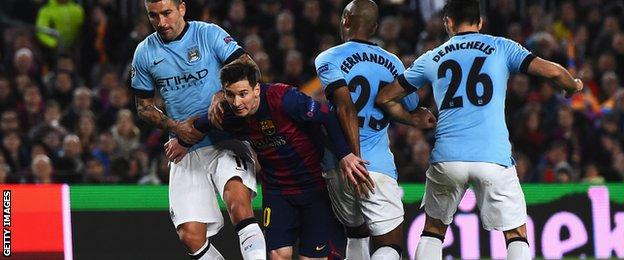 Lionel Messi takes on three Man City defenders