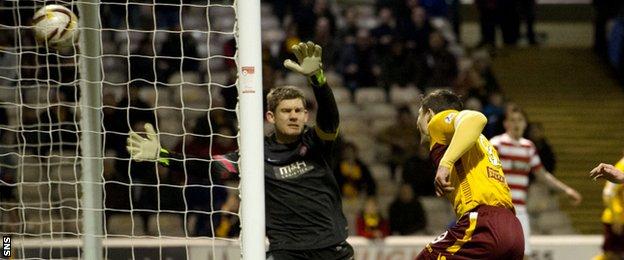 Motherwell striker John Sutton beats Hamilton keeper Michael McGovern to add to his side's lead.