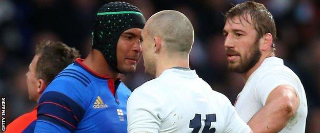 Thierry Dusautoir of France faces off with Mike Brown of England