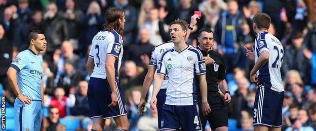 Referee Neil Swarbrick sends off Gareth McAuley