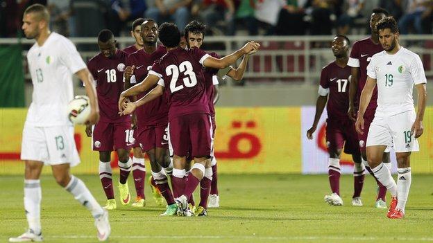 Qatar celebrate their goal