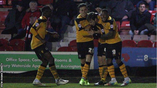 Newport County players celebrate after taking the lead at Accrington Stanley