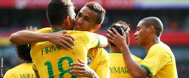 Brazil celebrate Roberto Firmino's goal