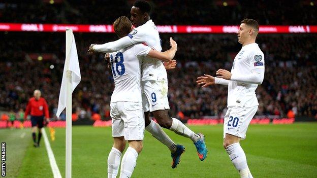 Kane celebrates his debut England goal with Danny Welbeck and Ross Barkley