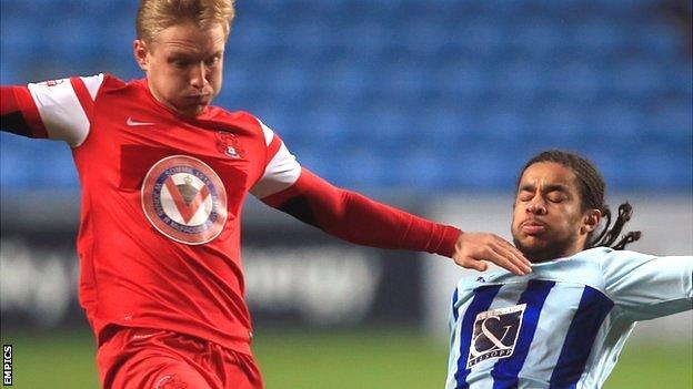 Coventry City's Dominic Samuel battles for ball with Leyton Orient's Josh Wright