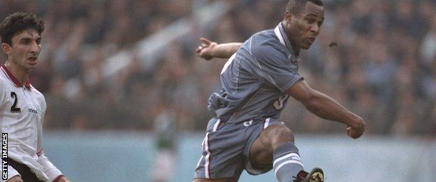 Les Ferdinand in action for England