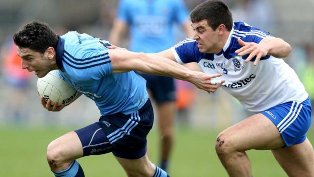 Dublin forward Bernard Brogan attempts to escape the clutches of Monaghan opponent Drew Wylie in the game at Clones