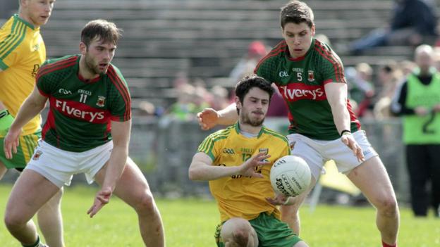 Donegal's Ryan McHugh comes under pressure from Mayo pair Aidan O'Shea and Lee Keegan