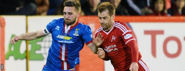 Graeme Shinnie (left) will be an Aberdeen player next season
