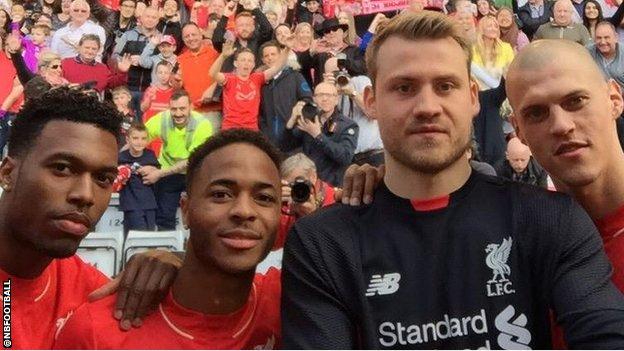 Raheem Sterling, second from left, with Liverpool team-mates, from left, Daniel Sturridge, Simon Mignolet and Martin Skrtel.