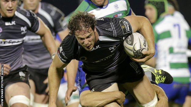 Tyler Ardron on the attack for Ospreys is tackled by Treviso's Edoardo Gori