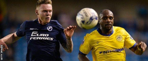 Aiden O"Brien of Millwall FC and Emmerson Boyce of Wigan