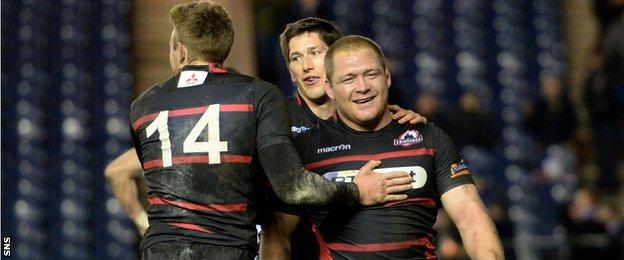 WP Nel is congratulated by teammates Dougie Fife and Sam Beard