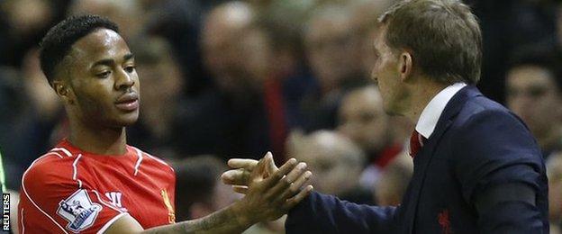 Liverpool forward Raheem Sterling with manager Brendan Rodgers