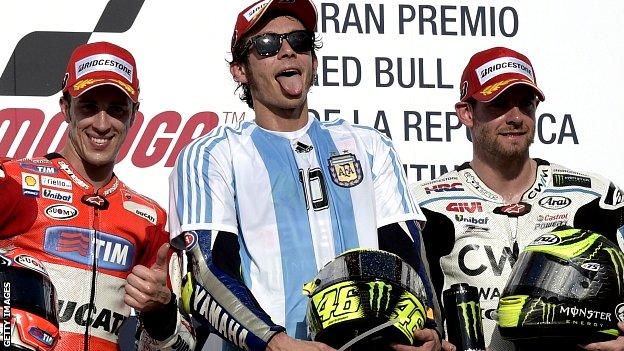 Italy's Valentino Rossi (C) of Yamaha, Italian Andrea Dovizioso (L) of Ducati, and Britain's Carl Crutchlow of Honda