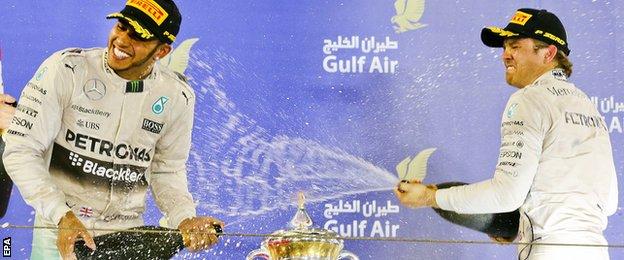 Lewis Hamilton and Nico Rosberg celebrate on the podium at the Bahrain GP