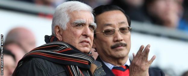 Sam Hammam (left) and Vincent Tan (right)