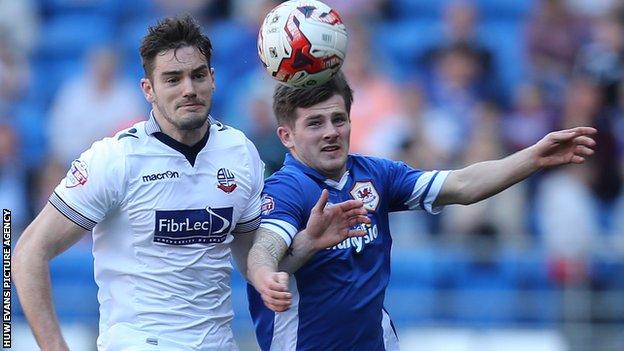 Cardiff City's Matthew Kennedy takes on Dorian Dervite of Bolton