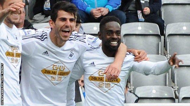 Nelson Oliveira (centre) celebrates Swansea's equaliser in the win at Newcastle - his first goal for the club