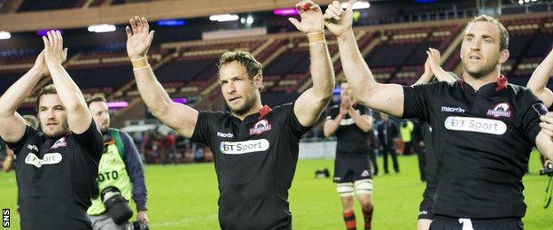 Edinburgh Andries Strauss (centre) alongside Mike Coman (right) celebrate the 45-16 European Cup semi-final win over Newport Gwent Dragons